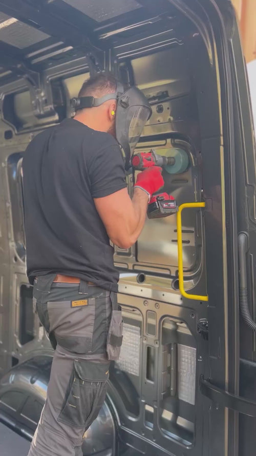Vanbitious technician preparing a van for a bonded window installation